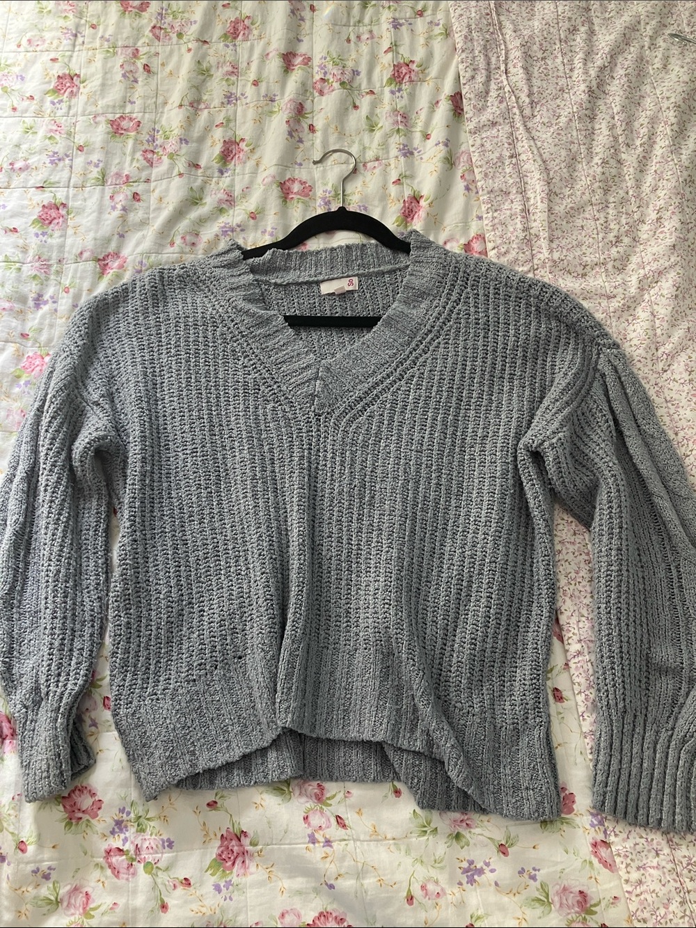 Gray oversized sweater with cable knit detail